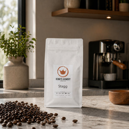 Bag of King's Gambit Coffee Stagg Organic Medium Dark Roast coffee beans in a resealable bag.